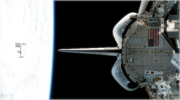 Shuttle payload ready to dock with the visible ISS.